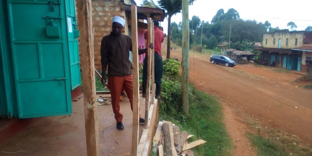 Local carpenters at work building out the lab veranda.